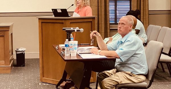 Mayor James R. Knight Jr. listens as city finance employee Melissa Clayton outlines the 2023-24 budget proposal for council members at a May 18, 2023, Committee of the Whole meeting. (Hoptown Chronicle photo by Jennifer P. Brown)