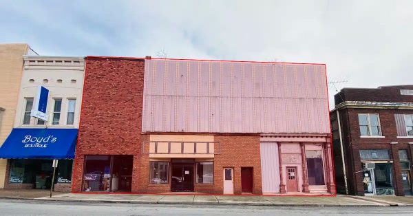 The former Holland Opera House (the structure with a metal facade on the upper level) and the adjacent Lee’s Game Room (to the left) are shaded in red. The buildings have been recommended for demolition by an engineer the city hired to inspect the properties. (Hoptown Chronicle graphic | Photo by Jennifer P. Brown)