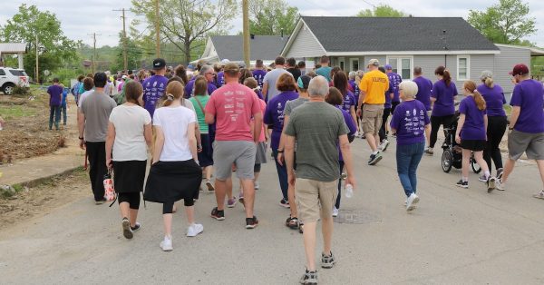 Dawson Springs community members begin their Walk for Dawson on Saturday, April 30, through tornado damaged areas of the town. (Photo by Lily Burris)