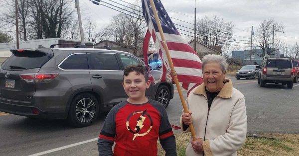 Shyler and Beverly Hulsey wait on Wednesday, Dec. 15, 2021 on a Dawson Springs street for President Biden's motorcade. (Photo from Kentucky Public Radio)