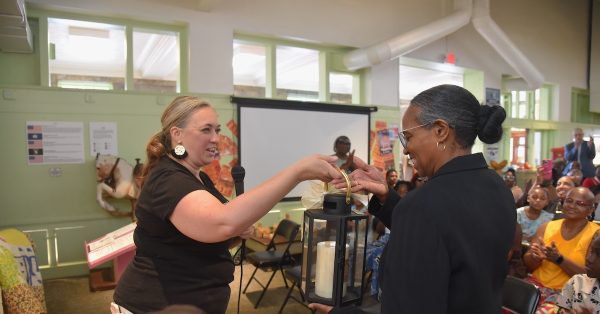 Alissa Keller (left), executive director of the Museums of Historic Hopkinsville-Christian County, presents the Olde Lamplighter Award to Diane Croney Turner during Sunday's Eighth of August observance at the Pennyroyal Area Museum. (Hoptown Chronicle photo by Jennifer P. Brown)