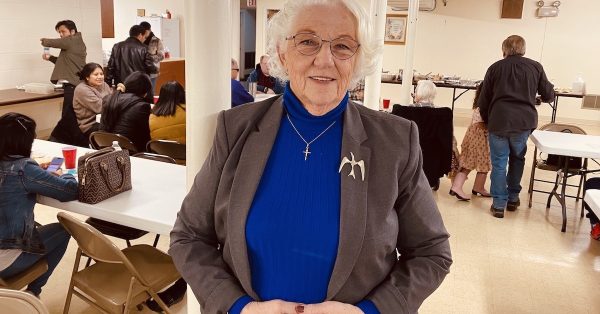 Pastor Donna Williams stands in the basement fellowship hall of Christian Heights United Methodist Church, where congregants were sharing a Thanksgiving potluck meal on Nov. 20, 2022. (Hoptown Chronicle photo by Jennifer P. Brown)