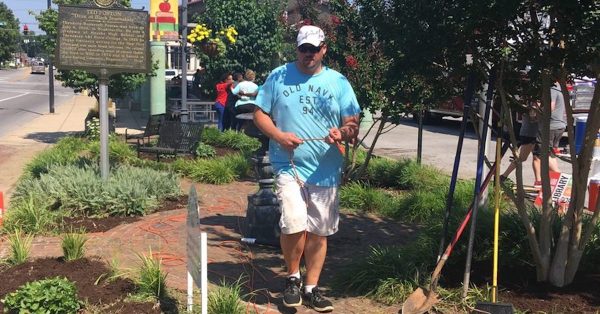 Chris Miller helps finish some landscape work with Leadership Hopkinsville Alumni Saturday, June 29, at Founders Square. (Photo by Jennifer P. Brown)