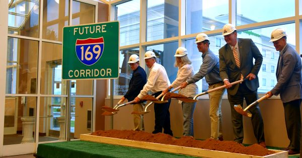 Celebrating the start of interstate upgrades to the Pennyrile Parkway are (from left) Chamber of Commerce President Taylor Hayes, Mayor James R. Knight Jr., Hopkinsville resident Annie Mahre, Gov. Andy Beshear, Christian County Judge-Executive Jerry Gilliam and Carter Hendricks, executive director of the South Western Kentucky Economic Development Council. They had the symbolic groundbreaking indoors, because of ran, on Thursday, Aug. 2, 2023, at The Bruce Convention Center. (Hoptown Chronicle photo by Jennifer P. Brown)