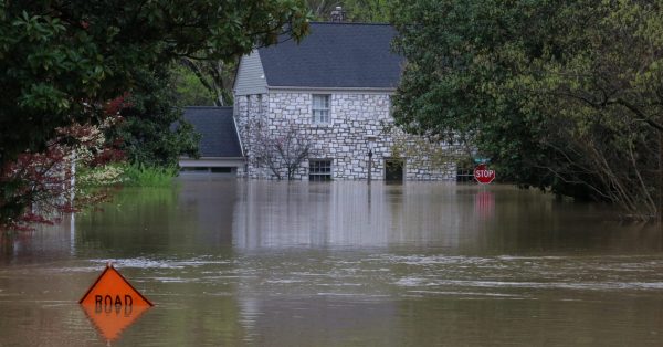 house submerged by floodwaters