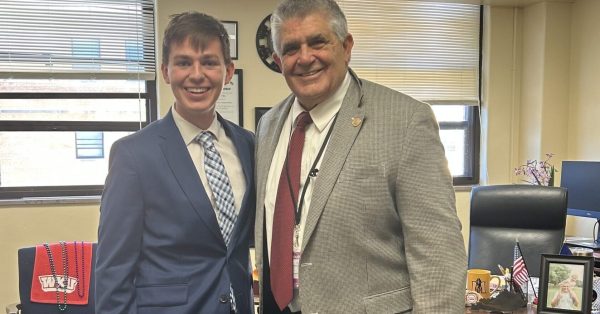 Alex Young, left, a college student from Louisville and vocal opponent of corporal punishment, posed with Rep. Steven Riley, a retired educator and Republican from Glasgow, who has tried a number of times to get the legislature to ban the practice. (Photo provided)