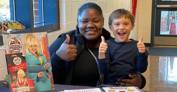 Melia Seabrooks (left) and Jackson get ready to sign children up for the Dolly Parton Imagination Library on Nov. 1, 2019, at Millbrooke Elementary School in Hopkinsville. (Hopkinsville-Christian County Public Library | File photo)