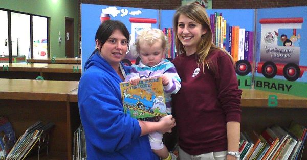 Maddalynn Gydesen (center) and her mother are helped by Tana Lea Meade as Maddalynn picks up her first Imagination Library book. (Hopkinsville-Christian County Public Library.)