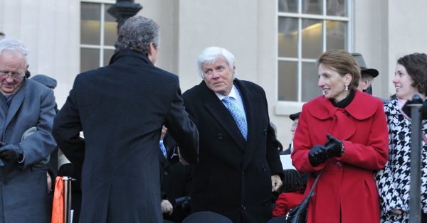 John Y. Brown Jr. shaking hands with Fischer