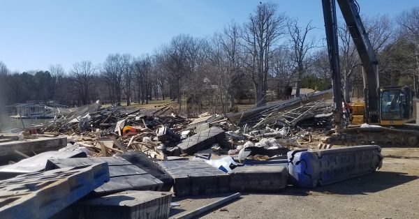 Living Lands and Waters, a nonprofit river cleanup organization, has been cleaning tornado debris out of Kentucky Lake and off the shoreline in Marshall County following the December tornado outbreak. (Photo by Lily Burris, WKMS)