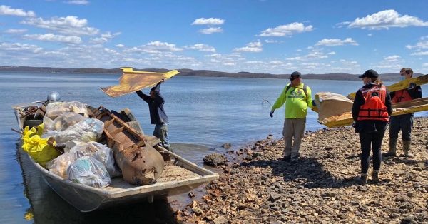 Volunteers with one of the trash boats at Kentucky Lake. (Keep the Tennessee River Beautiful photo)