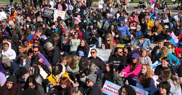 A crowd protesting anti-LGBTQ+ legislation staged a “die in” on the Capitol grounds to demonstrate what they said could be the fallout from SB 150, students dying. (Kentucky Lantern photo by Sarah Ladd)