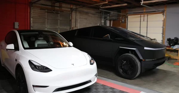 Mark and Pam Glover, business owners in Paducah, own two electric vehicles, both Teslas. They're a part of the growing population of EV owners in Kentucky. (Photo by Lily Burris | WKMS)