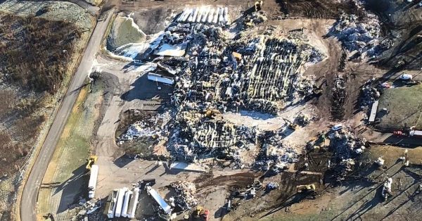 An aerial photo shows the aftermath of December’s deadly tornado at Mayfield Consumer Products, a candle factory. More than 100 people were trapped when the factory collapsed during the disaster and nine deaths were connected with the collapse. (Photo courtesy of John Hewlett)