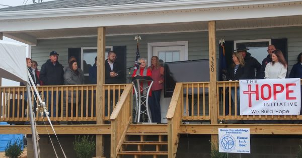 Officials for Mayfield and Graves counties joined community members Tuesday to recognize the third anniversary of the EF-4 tornado that hit the region. They awarded keys to eight new homes for tornado survivors. (WKMS photo by Hannah Saad)