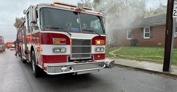 A Hopkinsville Fire Department truck sits in front of an East Fourth Street house where Police Chief Jason Newby rescued a woman from the burning structure on the morning of Monday, Oct. 30, 2023. (Hopkinsville Fire Department photo)