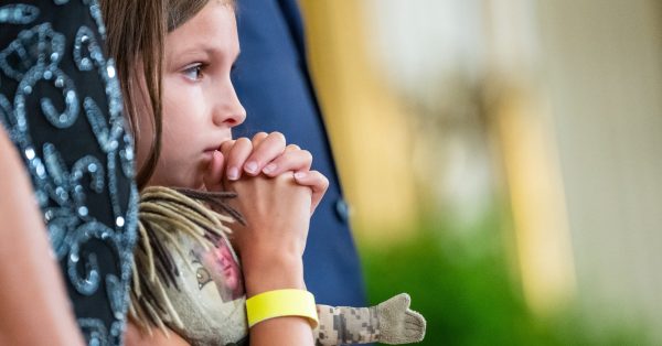 Brielle Robinson, daughter of Sgt. First Class Heath Robinson, listens during a signing ceremony for the "Sergeant First Class Heath Robinson Honoring our Promises to Address Comprehensive Toxics (PACT) Act of 2022" Wednesday, August 10, 2022, in the East Room of the White House. (Official White House Photo by Erin Scott)