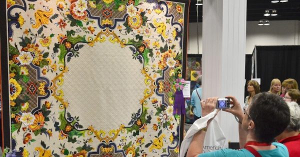 An attendee at the 2014 QuiltWeek takes a photo. (WKMS photo)