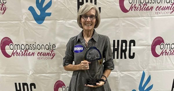 Patricia Beliles holds the Hal and Bettye Thurmond Award presented to her at the 2022 Unity Breakfast. (Facebook photo)