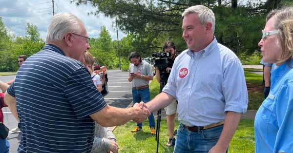 Agriculture Commissioner Ryan Quarles (center) shakes hands with a man during a stop Saturday, May 13, in Shepherdsville. Quarles has been on his Big Red Truck tour of the state to convince voters he’s the right choice to take on Democratic incumbent Gov. Andy Beshear in the November election. (Kentucky Lantern photo by McKenna Horsley)