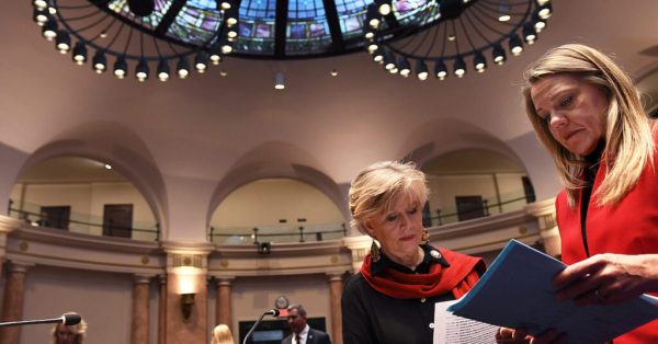 Rep. Jennifer Decker (left), the sponsor of an anti-DEI bill filed Friday, and Rep. Emily Callaway look over legislation before the start of the House session on Jan. 10. (Kentucky Legislative Research Commission photo)