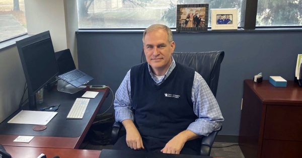 Rodney Andrews at desk