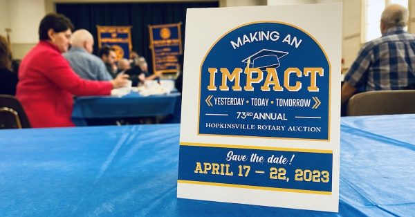 A save-the-date card promotes "Making an Impact" as the theme unveiled Tuesday, Jan. 10, for the 2023 Hopkinsville Rotary Auction. (Hoptown Chronicle photo)