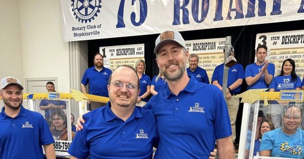 Hopkinsville Rotarians Brett Pritchett (left) and Landan Stallons celebrate a big finish Saturday evening for the 75th Hopkinsville Rotary Auction. Landan chaired this year's auction, and Pritchett will chair next year. (Hopkinsville Rotary photo)