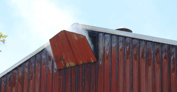 White smoke escapes from a vent on this tobacco barn on Kentucky 2547 South in Calloway County. (Murray Sentinel photo by Jessica Paine)