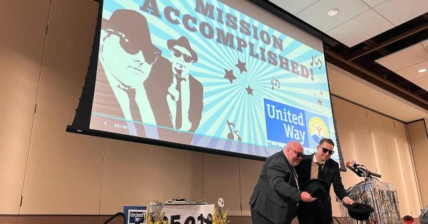 United Way campaign chairman Chris Jung (left) and Cody Noffsinger take a bow at the campaign celebration on Tuesday, Feb. 20, 2024, at the James E. Bruce Convention Center. (Photo provided)