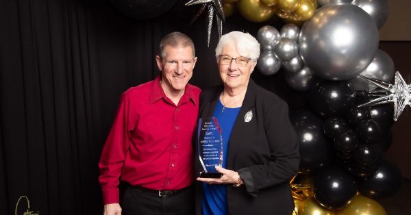 Donna Williams poses with Curt Anderson, executive director of the Aaron McNeil House, after she received the Beverly Whitfield Award at the United Way of the Pennyrile campaign celebration Tuesday, Feb. 25, at the James E. Bruce Convention Center. (United Way photo by Cat Lacy)