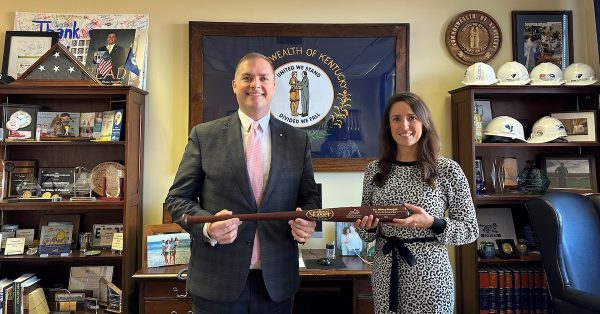 State Sen. Whitney Westerfield, R-Crofton, accepts a Louisville Slugger bat signifying his Kentucky Chamber of Commerce MVP Award from Kate Shanks, the chamber's senior vice president of public affairs. (Chamber photo)