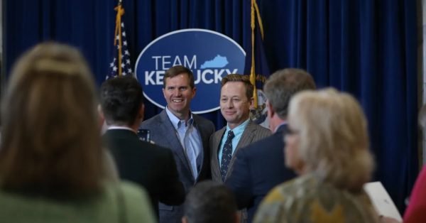 Kentucky Governor Andy Beshear (left) and Silas House at a ceremony in late April during which the Governor appointed Whitley County native and award-winning author as the 2023-24 Kentucky Poet Laureate. (Source: Governor Andy Beshear Flickr)