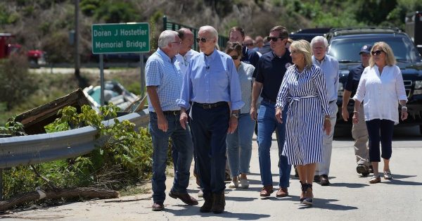 President Joe Biden and first lady Jill Biden walk in one of the communities devastated by flooding in Eastern Kentucky. (Photo from Gov. Andy Beshear's Facebook page)