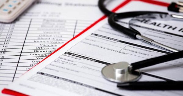 Health care costs. Stethoscope and calculator symbol for health care costs or medical insurance.