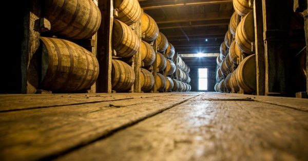 bourbon barrels in distillery