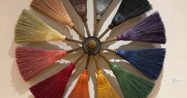 An art piece featuring custom-made brooms by Shannon Lewis. (Photo from Janice Mason Art Museum)