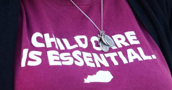 woman wearing childcare shirt