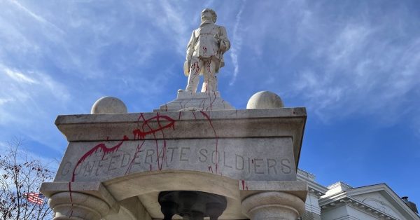 Red lines cover the Confederate monument in downtown Murray. (Photo by Liam Niemeyer, WKMS)