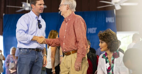 Governor Andy Beshear shakes hands with Senator Mitch McConnell during the 143rd Fancy Farm Picnic on Saturday, Aug. 5, 2023. (Kentucky Lantern photo by Austin Anthony)