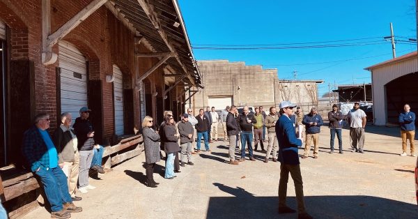 Potential bidders and onlookers gather for the auction of the L&N Freight Station in downtown Hopkinsville on Friday, Jan. 27, 2023. (Hoptown Chronicle photo by Jennifer P. Brown)