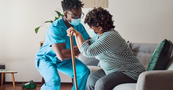 nursing home staff helping resident