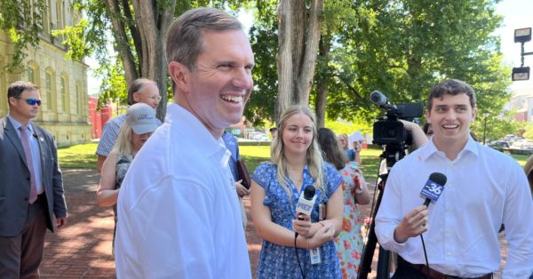 andy beshear smiling outside