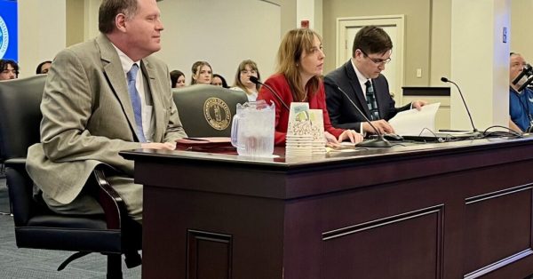 Kentucky Auditor Allison Ball, center, spoke to lawmakers on July 30. about access to computerized records of child and elder abuse cases. Ombudsman Jonathan Grate is at left and Alexander Magera, general counsel in the auditor’s office, is at right. (Kentucky Lantern photo by Sarah Ladd)