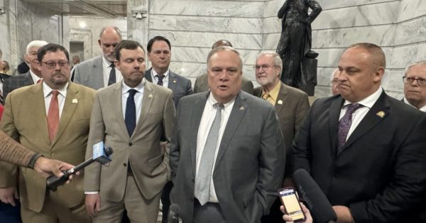 Men of the legislature gathered with Senate President Robert Stivers to talk to media after overriding Gov. Andy Beshear’s veto of a bill that preempted housing discrimination ordinances in Louisville and Lexington. (Kentucky Lantern photo by Liam Niemeyer)