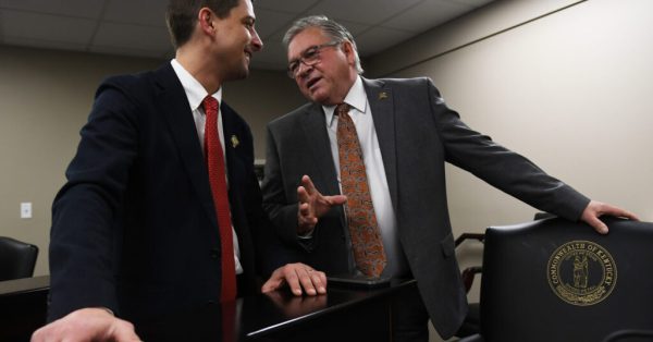 FRANKFORT, March 13 – Rep. Jacob Justice, R-Elkhorn City, (left) talks with House Committee on Local Government Chairman Rep. Randy Bridges, R-Paducah, before the start of Wednesday’s committee meeting.