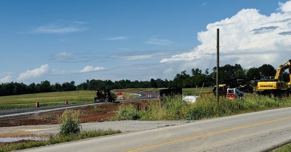 An industrial connector road, seen here on July 9, 2024, adjacent to Kentucky 115 at Pembroke near Rosedale Cemetery, will link Interstate 24 to Commerce Park and Commerce Park II near Pembroke Road. (Hoptown Chronicle photo by Jennifer P. Brown)