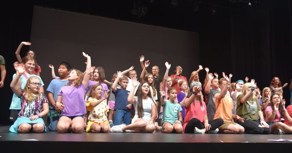 "Rapunzel" cast members gather on stage at the end of rehearsals Wednesday, July 26, 2023, at the Alhambra Theatre. (Hoptown Chronicle photo by Jennifer P. Brown)
