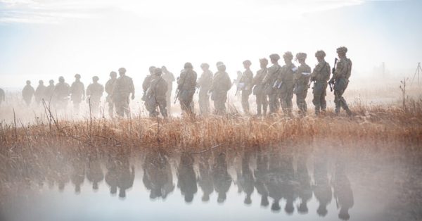 soldiers walking in fog