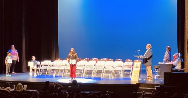 Zoey Harbold, of Heritage Christian Academy, spells her final word to win the elementary division in the Christian County Literacy Council's second annual spelling bee on Sept. 27, 2022, at the Alhambra Theatre. (Hoptown Chronicle photo by Jennifer P. Brown)